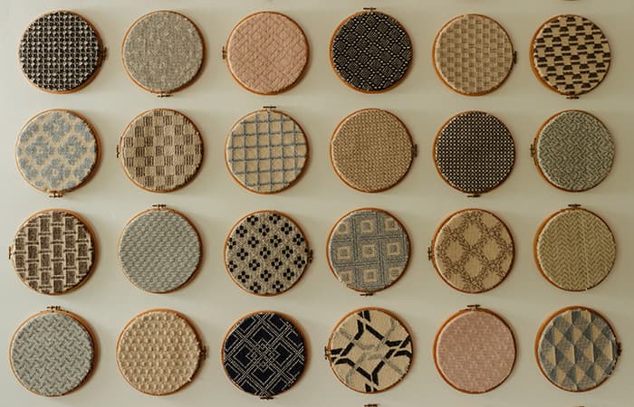 Wool fabric swatches in embroidery hoops