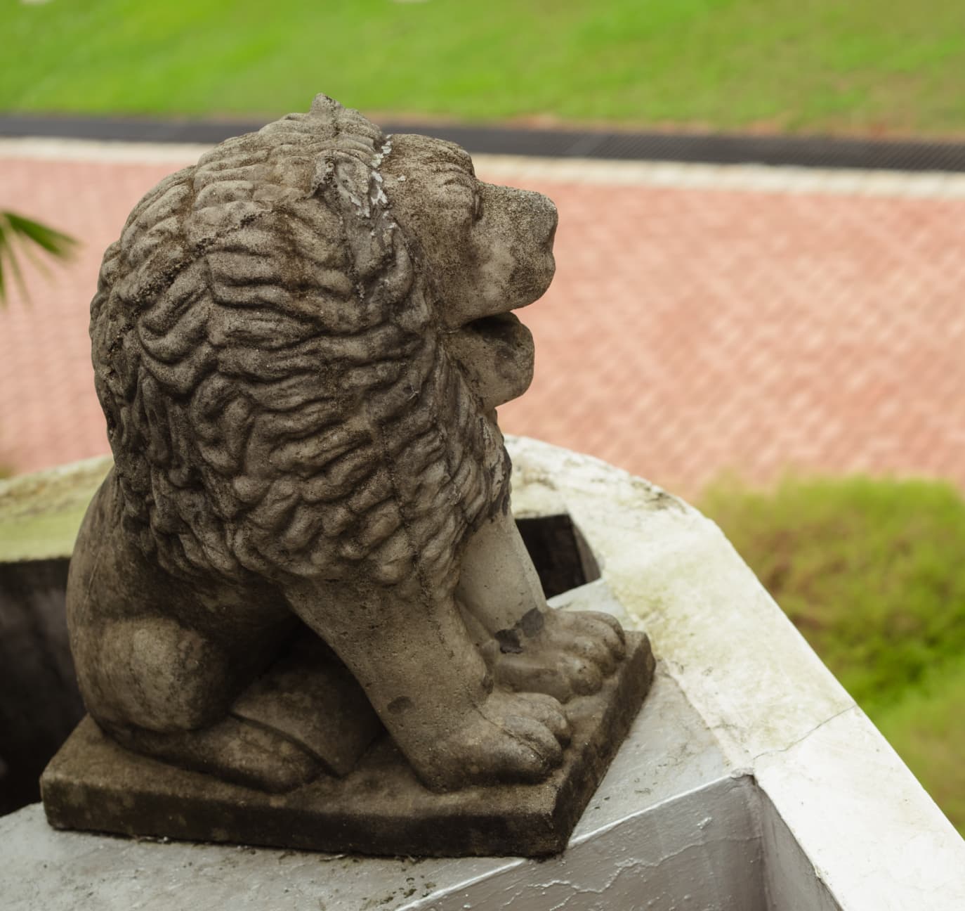 Stone lion statue at the Wilton Weavers grounds